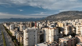 Panorama Of The Buildings On The Coastline City Alanya Turkey Aerial view City panorama on the seashore 4K aerial view