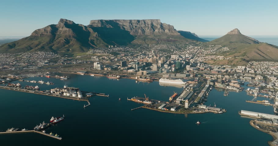 Spectacular high aerial view of Cape Town Waterfront, Harbour, City Centre, Table Mountain, Lion's Head, Signal Hill, Cape Town,  South Africa Royalty-Free Stock Footage #1103177389