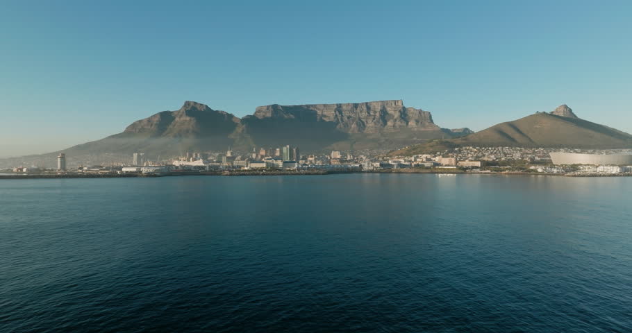 Spectacular aerial fly over view of Cape Town Stadium, Waterfront, Harbour, City Centre, Table Mountain, Lion's Head, Signal Hill, Cape Town,  South Africa Royalty-Free Stock Footage #1103177455