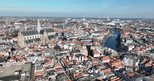 Discover the stunning beauty of the Gothic-style St.-Bavokerk cathedral with an aerial drone video of Haarlem's Grote Markt.