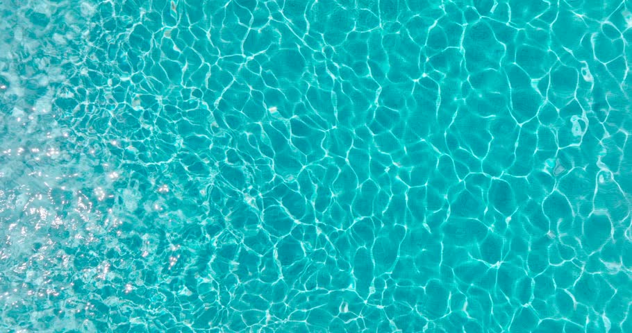 Blue water in the swimming pool with light reflections. | Shutterstock HD Video #1103189521