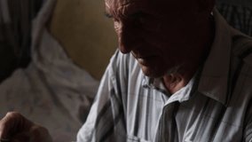 pensioner sorting through old family photos laid out on the table. an elderly man is looking at old family photos. the concept of nostalgia for the past - Powered by Shutterstock - Get 15% off with code: PIKWIZARD15