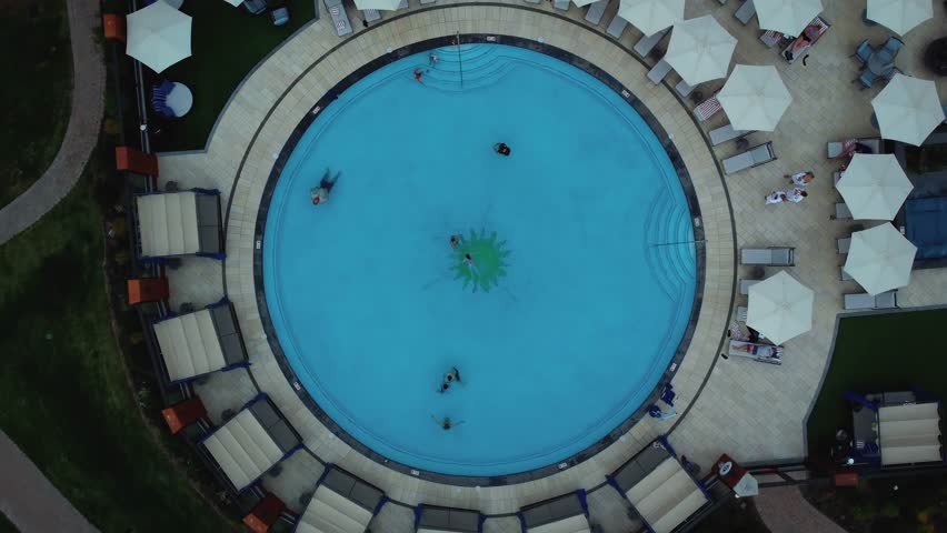Round Outdoor Pool At Sun Valley Resort Hotel In Sun Valley, Idaho. aerial topdown rotate