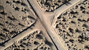 Overhead View Of Unpaved Cross Road Intersection At Joshua Tree National Park In California. - aerial - Powered by Shutterstock - Get 15% off with code: PIKWIZARD15