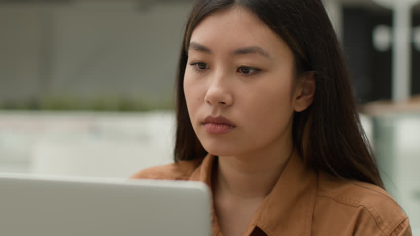 Overworked Asian woman girl working laptop in cafe suffer eyestrain tired chinese businesswoman freelancer overload with computer work rub eyes pain discomfort exhaustion blurry vision bad eyesight Royalty-Free Stock Footage #1103200309