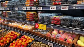 Fruits and vegetables on display in a supermarket. High quality 4k footage