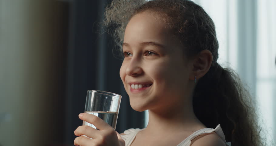 Cute Child Girl Drinking Glass Fresh Transparent Pure Filtered Mineral Water at Home. Slow Motion Little Girl Drinks Water. Closeup Kid drinking Cup Water Healthy Body Care. Healthy lifestyle Children Royalty-Free Stock Footage #1103205649