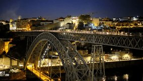 A fantastic large steel bridge on a late twilight, with many pedestrians walking on it. a vivid nightscape scenery with a European old town beyond the bridge. a 4K video clip, Porto, Portugal.