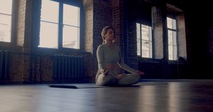 Mental health witn yoga practice. Young woman practices yoga. Balance, mental health, slowlife and digital detox concept. Zoom in video.