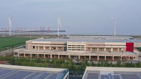 Aerial Shot of Distribution Warehouse with Windmills in the Background - Powered by Shutterstock - Get 15% off with code: PIKWIZARD15
