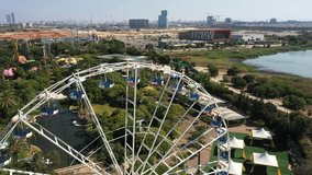 Aerial video of a giant wheel in an amusement park