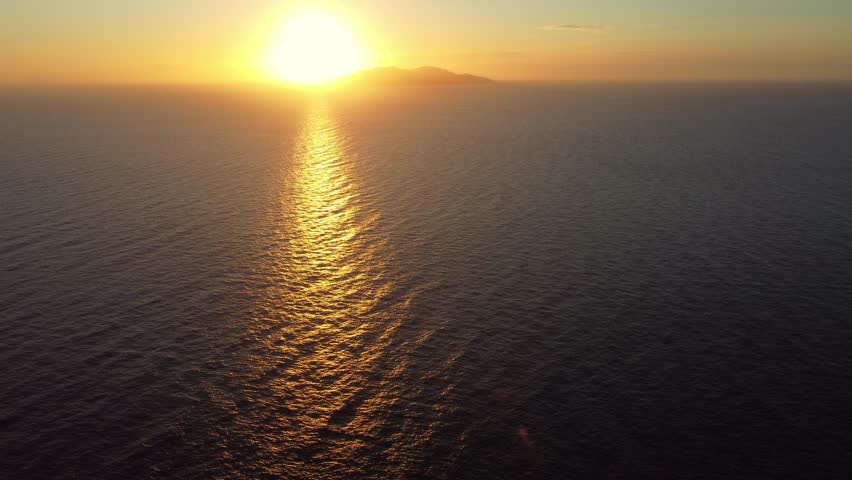 Panoramic aerial view of stunning sunset on the sea with Giglio island in the background.  Royalty-Free Stock Footage #1103226865