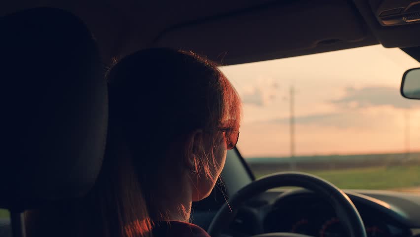 beautiful woman driving car. good mood travel. girl driving car talking and smiling. woman sits front seat car. girl road. driver driving van. holidays nature day off. vacation girlfriend. smile mom. Royalty-Free Stock Footage #1103228751