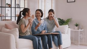 Recall the past life memories Happy time Mother's day grown up kid child joy fun look at old retro photo album with mature mum. Asia adult people middle age mom smile enjoy relax sitting at home sofa. - Powered by Shutterstock - Get 15% off with code: PIKWIZARD15