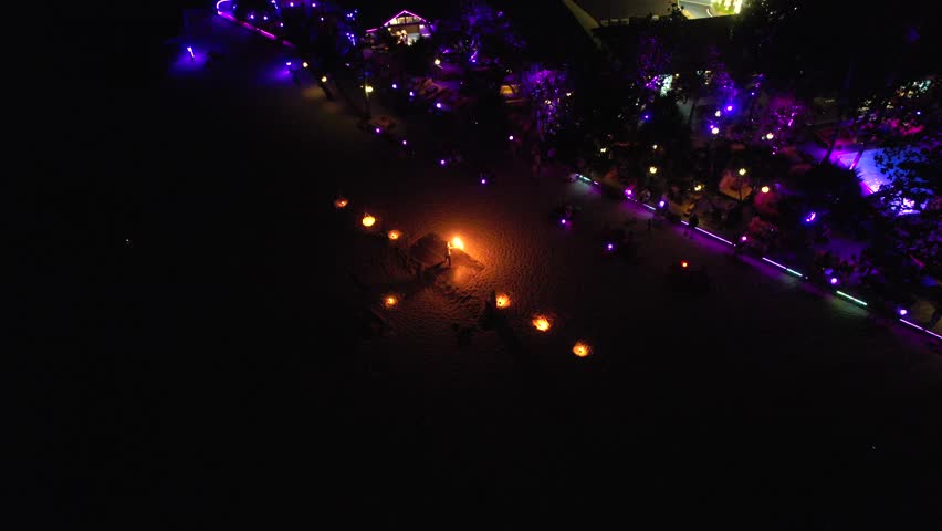 Aerial view of a fire show on the beach in Phuket, Thailand