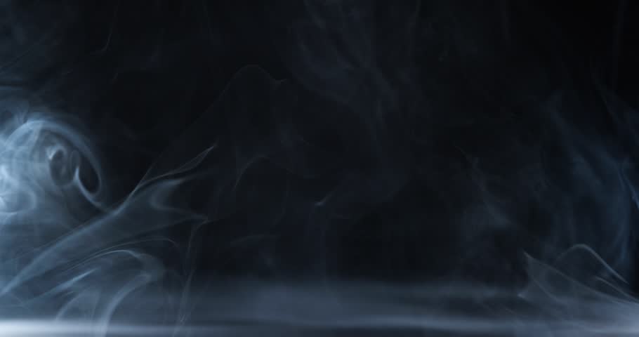White cloudiness, mist or smog moves on black background. Beautiful swirling smoke. Mockup for your logo. Wide angle horizontal wallpaper or web banner. Royalty-Free Stock Footage #1103236395