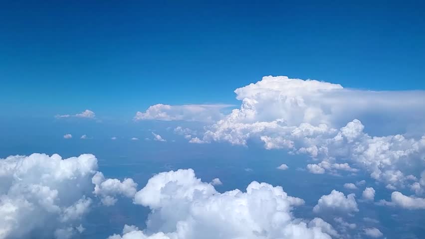 View of clouds in sky from plane in daytime Royalty-Free Stock Footage #1103243063