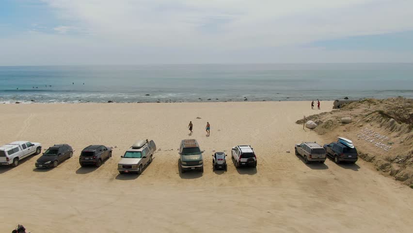 PUNTA GORDA BEACH BCS MEXICO-2023: A Group Of Cars Parked On Top Of A Sandy Beach