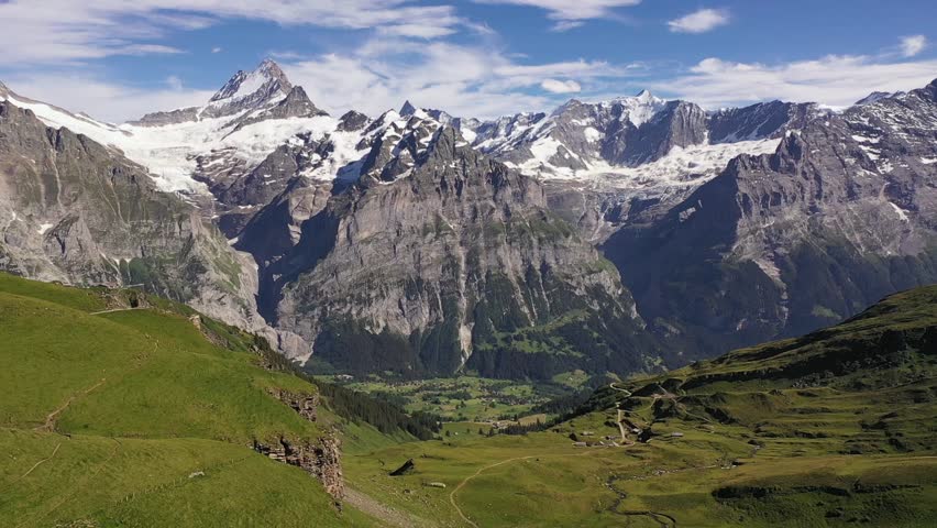 Dramatic aerial view of Snow-capped swiss alp mountains Schreckhorn and Finsteraarhorn just against famous Alpine Bachalpsee lake in Grindelwald-First, Bernese Alps, Switzerland, Europe