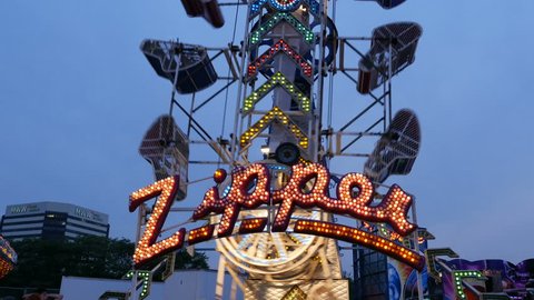 EAST RUTHERFORD, NEW JERSEY - JULY 3: Zipper ride in motion during the New Jersey State Fair in Bergen County on July 3, 2015 in East Rutherford, New Jersey.