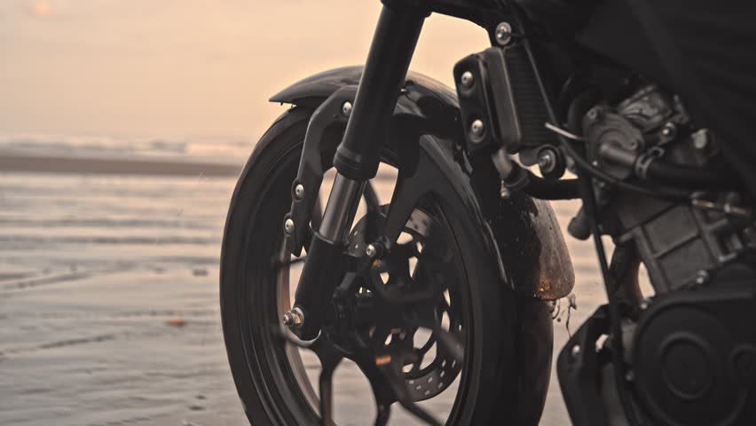 Person Riding Bike in Summer Landscape of Beach Traveling in Outdoors Nature. Handsome Motorcyclist or Surfer Driving Motorcycle in Speed Shot. Lifestyle of Alone Man in Motion on Stylish Transport 4k