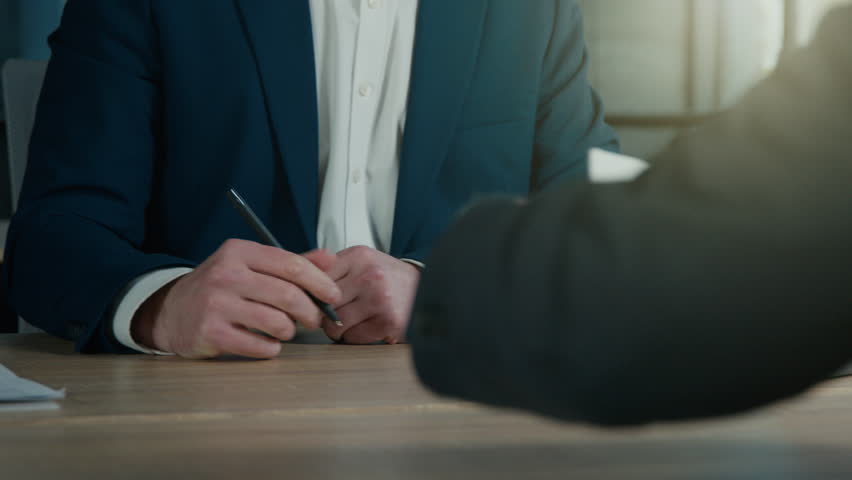 Close-up unrecognizable businessman signing contract to starting project investment putting signature on legal document men business partners make deal at office sign report making financial agreement Royalty-Free Stock Footage #1103268335