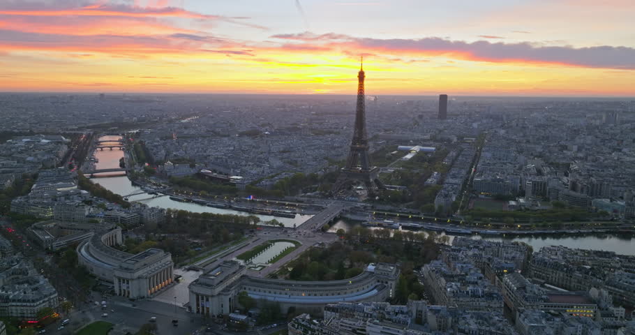 Beautiful view of famous Eiffel Tower in France with colorful twilight romantic sky. Wide establishing aerial morning sunrise or sunset of paris city center best travel destinations landmark in Europe Royalty-Free Stock Footage #1103270773