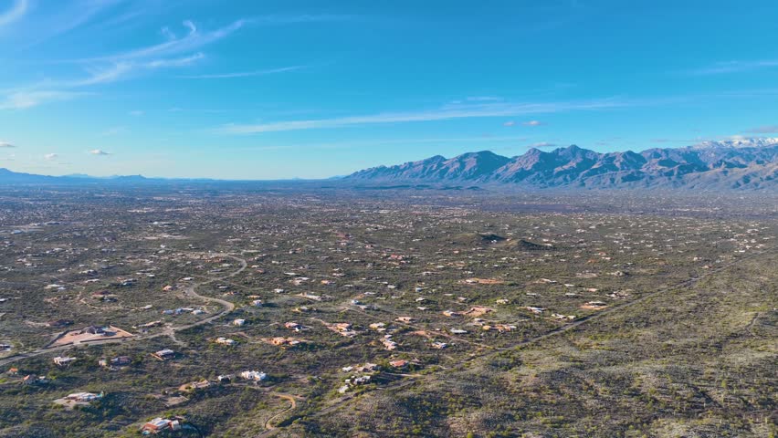 Panoramic view of Sonoran Desert landscape including Mt Lemmon in Santa Catalina Mountains and Rincon Mountains in Saguaro National Park east in city of Tucson, Arizona AZ, USA.