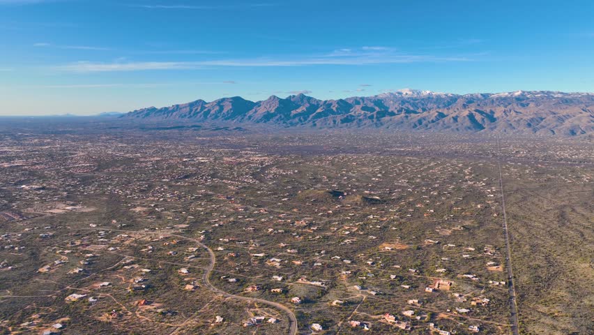 Panoramic view of Sonoran Desert landscape including Mt Lemmon in Santa Catalina Mountains and Rincon Mountains in Saguaro National Park east in city of Tucson, Arizona AZ, USA.
