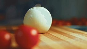 Steam transformation effect of Chopping onions chef on a wooden board. close up, nice decoration. Pleasant atmosphere. 4k Video.