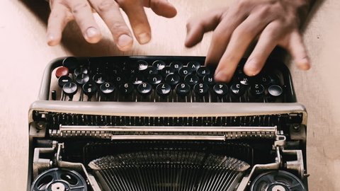 Typing a film script or a book on a vintage typewriter