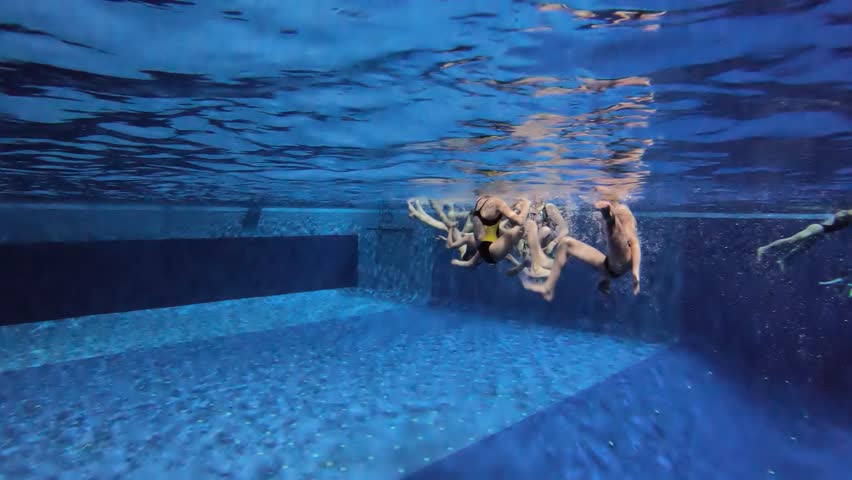 Synchronized swimming junior team underwater training in the swimming pool Royalty-Free Stock Footage #1103292869