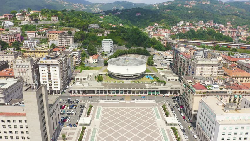 Inscription on video. La Spezia, Italy. Cathedral of Christ the King. City view. Shimmers in colors purple, Aerial View
