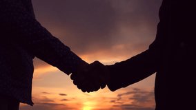 Business people shake hands outdoor. Two businessmen shaking hands signed contract. Conclusion of deal, Handshake agreed. Business through handshake. Hand silhouette. Greetings, sky. Trust partner - Powered by Shutterstock - Get 15% off with code: PIKWIZARD15