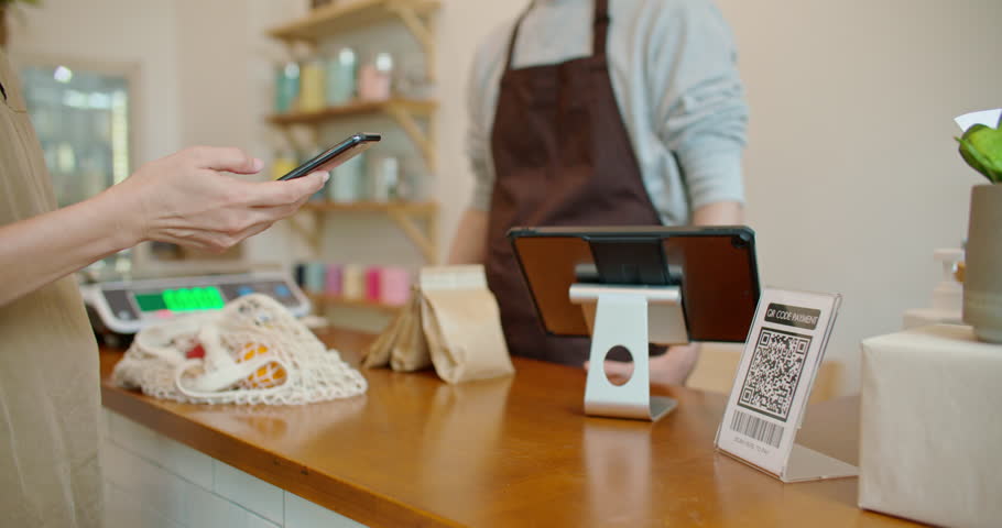 Customer using smartphone scanning shop QR code for contactless paying at zero waste plastic free grocery store. Cashless payment lifestyle. Small business go green startup for reduce climate change. Royalty-Free Stock Footage #1103301459