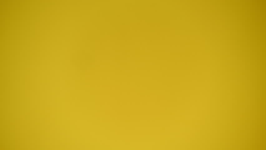 4k video of one girl showing thumb down on yellow background.
