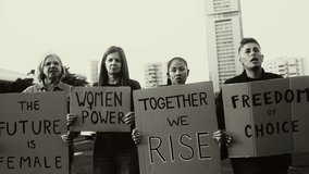 Demonstration of feminist movement protesting for female rights - Women empowerment concept - Black and white editing - Powered by Shutterstock - Get 15% off with code: PIKWIZARD15