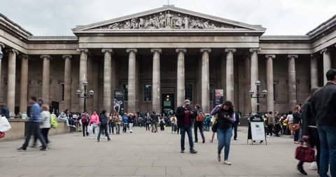 LONDON, UNITED KINGDOM - JUNE 22, 2015: Tourists in front of British Museum entrance. The British Museum's collections number more than 7 million objects from all over the world. 