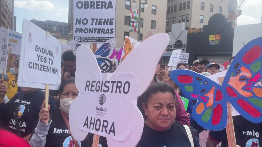 People participate in the annual May Day march to mark International Workers Day in downtown Los Angeles, Monday, May 1, 2023. 