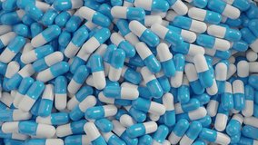 Many colorful capsule pills spin around. View from the top 
3D render animation - Powered by Shutterstock - Get 15% off with code: PIKWIZARD15