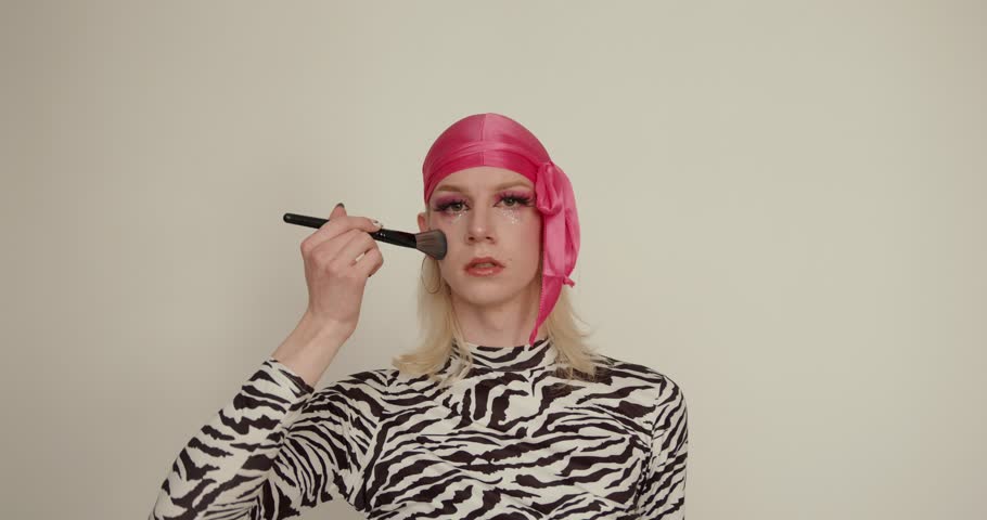 Transgender Caucasian man posing on camera in the studio