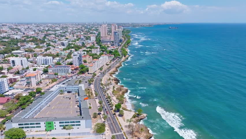 Aerial drone view along George Washington avenue pier and cityscape, Santo Domingo, Dominican Republic Royalty-Free Stock Footage #1103319953