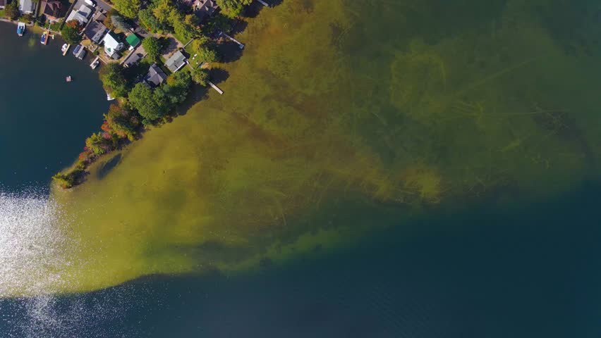 Aerial view of Lake Winnisquam and Winnisquam Sand Bar with US Route 3 bridge between town of Belmont and Sanbornton in New Hampshire NH, USA. 