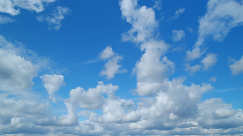 Blue sky with beautiful cirrus and cumulus on different layers clouds. Beautiful sunny blue sky background with cirrus clouds. Timelapse. Royalty-Free Stock Footage #1103322689