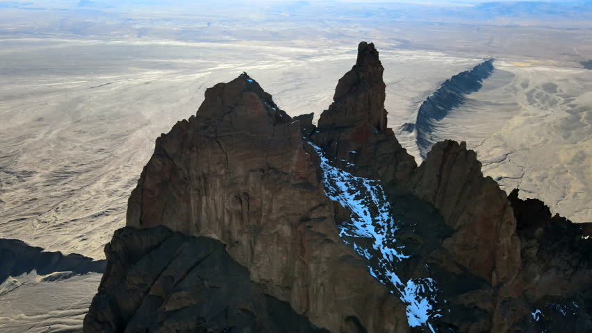 Aerial View Of Shiprock Peak With Snow In Daytime In San Juan County, New Mexico, USA.