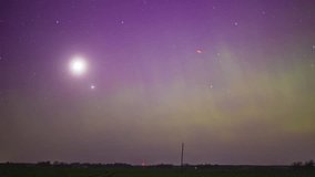 Moon, stars and the aurora borealis glow in the misty nighttime sky - time lapse - Powered by Shutterstock - Get 15% off with code: PIKWIZARD15