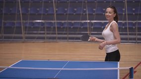 two women are playing table tennis. table tennis training. slow motion video. High quality Full HD video recording
