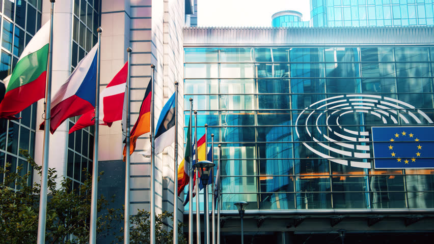 Flags of various European countries waving in front of Parliament building, Brussels 4K - Powered by Shutterstock - Get 15% off with code: PIKWIZARD15