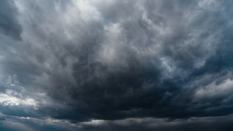 storm sky timelapse - dark dramatic clouds during thunderstorm, rain and wind, extreme weather, abstract background
: film stockowy
