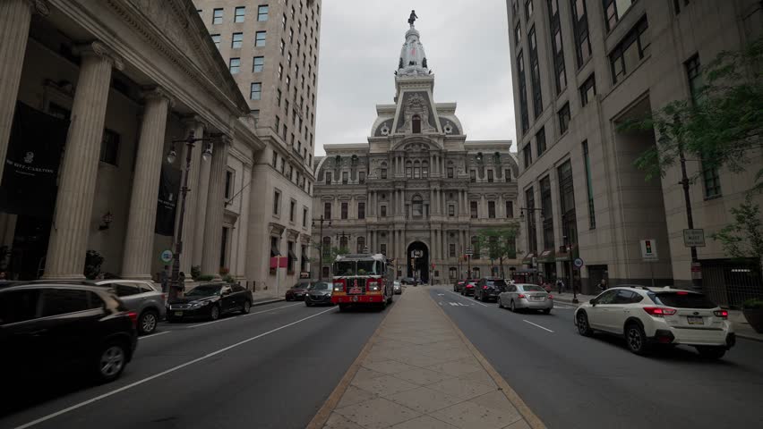 PHILADELPHIA, US - Jun 14, 2021: The busy streets leading to City Hall on Ben Franklin street on a cloudy day Royalty-Free Stock Footage #1103337179